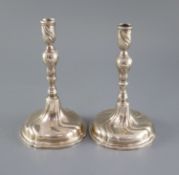 A pair of mid 18th century Danish silver candlesticks, with knopped stems and spiral decorated