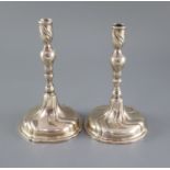 A pair of mid 18th century Danish silver candlesticks, with knopped stems and spiral decorated