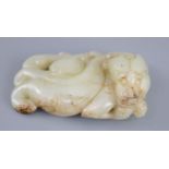 A Chinese pale celadon jade figure of a chilong, the figure with scrolling tail, the stone with