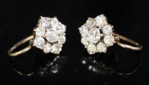 A pair of early 20th century gold and nine stone old cut diamond cluster earrings, diameter 10mm,