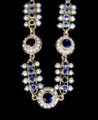 A late 19th/early 20th century French 18ct gold, sapphire and seed pearl set bar and circular link