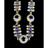 A late 19th/early 20th century French 18ct gold, sapphire and seed pearl set bar and circular link