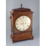 Dwerryhouse & Carter of London. A Regency brass inset mahogany mantel clock, with architectural case