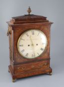 Dwerryhouse & Carter of London. A Regency brass inset mahogany mantel clock, with architectural case