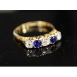 An early/mid 20th century 18ct gold and platinum, two stone sapphire and three stone old cut diamond