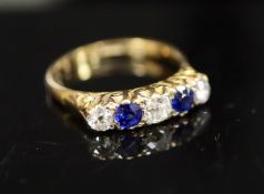 An early/mid 20th century 18ct gold and platinum, two stone sapphire and three stone old cut diamond