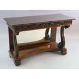 An early 19th century Anglo Indian padouk wood console table, with foliate carved frieze, front