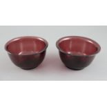 A pair of Chinese Beijing aubergine glass bowls, probably Qing dynasty, 10.5cm diameterCONDITION: