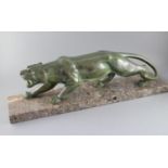 Brault. An Art Deco patinated bronze model of a prowling panther, with light green brown patination,
