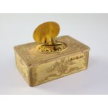 A late 19th century Swiss ormolu singing bird box, with flower and scroll engraved case, catch