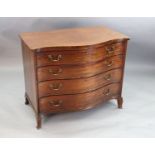 A George III serpentine mahogany dressing chest, fitted four graduated long drawers, the top