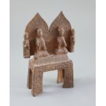 A Chinese cast iron votive group of two Buddhas and two attendants, Wei dynasty or later, on a