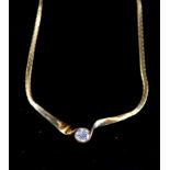 A modern 18ct gold flattened link and solitaire diamond set necklace, the diamond in a twist setting