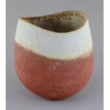 John Ward (b.1938). A hand-built stoneware vase, with asymmetric rim, rust graduating to duck egg