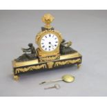 Thos. Hawley, 75 Strand, London. A Regency bronze and ormolu mantel timepiece, with central drum