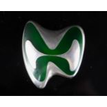 A late 1960's Danish Georg Jensen silver and green enamel abstract brooch, designed by Henning