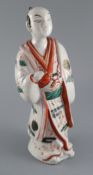 A Japanese porcelain figure of a man dressed in a kimono, Hizen, c.1690-1720, with unusual grey