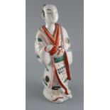 A Japanese porcelain figure of a man dressed in a kimono, Hizen, c.1690-1720, with unusual grey