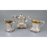 An early Victorian silver three piece tea set, by William Bateman, of waisted panelled form and