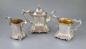 An early Victorian silver three piece tea set, by William Bateman, of waisted panelled form and