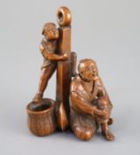 A Japanese boxwood okimono of two sailors and an anchor, Meiji period, one figure clambering on