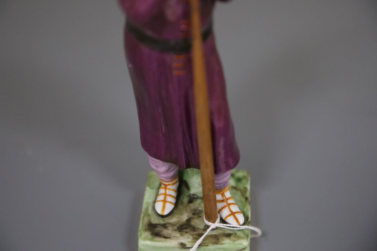 A Russian Gardner porcelain figure of a man holding a staff, mid 19th century, wearing traditional - Image 4 of 7