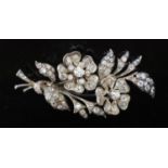 A Victorian gold, silver and graduated old round and cushion cut diamond set trembleuse floral spray