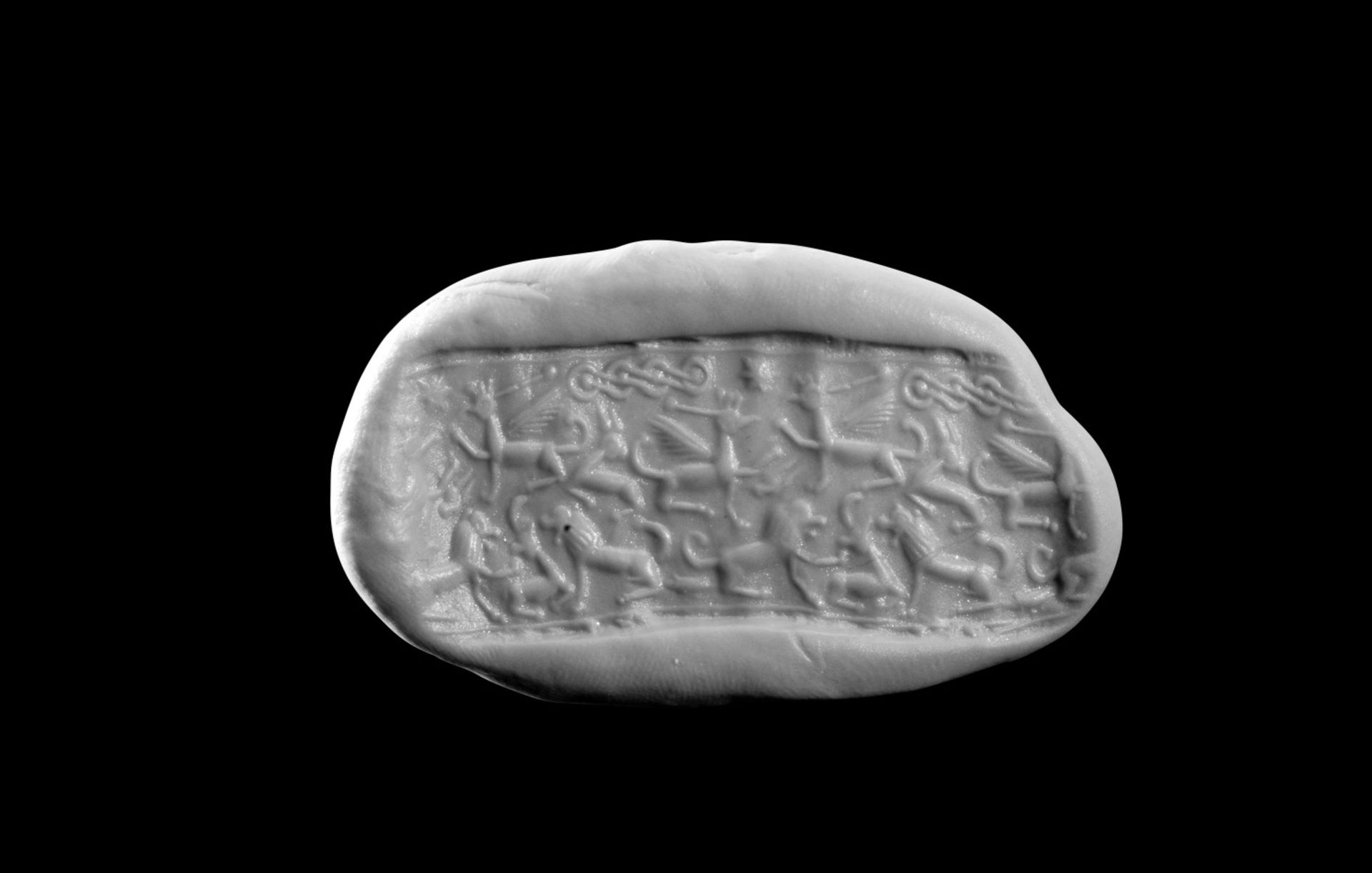 Rollsiegel aus Hämatit. Levante, ca. 1600 - 1450 v. Chr. H 2,1cm, ø 0,7cm. Mit vertikaler Bohrung. - Bild 2 aus 2