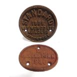 TWO CAST IRON WAGON PLATES comprising a circular manufacturer's plate, 'STANDARD /1956 / RLY WGN