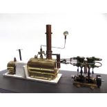 A SPIRIT-FIRED STATIONARY STEAM PLANT with a horizontal boiler, pressure gauge and twin cylinders,