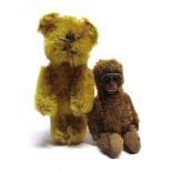 A MINIATURE GOLD MOHAIR TEDDY BEAR probably by Schuco, with a jointed body, 6.75cm high; together