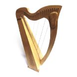 A 'MINSTREL' HARP, BY R. & J. BURKE labelled to the interior, the soundbox with carved Celtic-