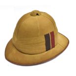 A BRITISH ARMY KHAKI WOLSEY PATTERN PITH SUN HELMET complete with leather sweatband and cloth