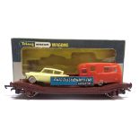 [OO GAUGE]. A WRENN NO.W4652P, LOW MAC WAGON 'AUTO DISTRIBUTORS' with a yellow Ford Anglia and a red