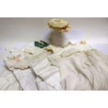 TEN ASSORTED BABIES' WHITE COTTON GOWNS together with a baby's cream silk bonnet; and a baby's