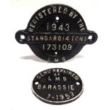 TWO CAST IRON WAGON PLATES comprising a manufacturer's plate, of circular form with fixing lugs, '