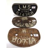 THREE CAST IRON WAGON PLATES comprising one G.W.R., 'G.W.Ry. / 14 TONS / 30774'; and two L.M.S., '