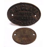 TWO CAST IRON WAGON PLATES comprising an oval manufacturer's plate, 'S.J. CLAYE / LIMITED / BUILDERS