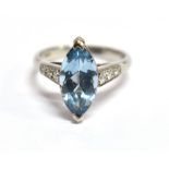 A MODERN AQUAMARINE SINGLE STONE AND DIAMOND SET PLATINUM RING The marquise shaped mixed cut