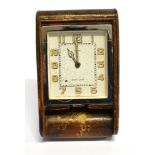 A JAEGER LE COULTRE 8 DAY TRAVEL CLOCK retailed by Asprey, in leather case, the ivory dial with