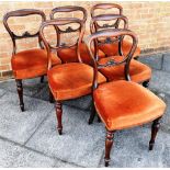 A SET OF SIX VICTORIAN MAHOGANY DINING CHAIRS with carved backrails and upholstered seats