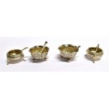 A PAIR OF VICTORIAN SILVER COULDRON SALTS AND SPOONS Of part fluted and floral decoration, with