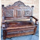 A CARVED OAK BOX SETTLE 118cm wide