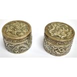 A PAIR OF EARLY 20TH CENTURY CHINESE EXPORT SILVER SMALL CYLINDRICAL BOXES of liddled form, embossed