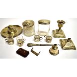 A GROUP OF SILVER AND GLASS ITEMS comprising two silver topped glass dressing table jars and four