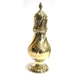 A VICTORIAN SILVER SUGAR CASTER the large caster of spiral facetted bulbous design, flower-head