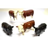 A GROUP OF BESWICK CATTLE comprising Hereford bull, polled bull and cow, and an Angus cow and bull