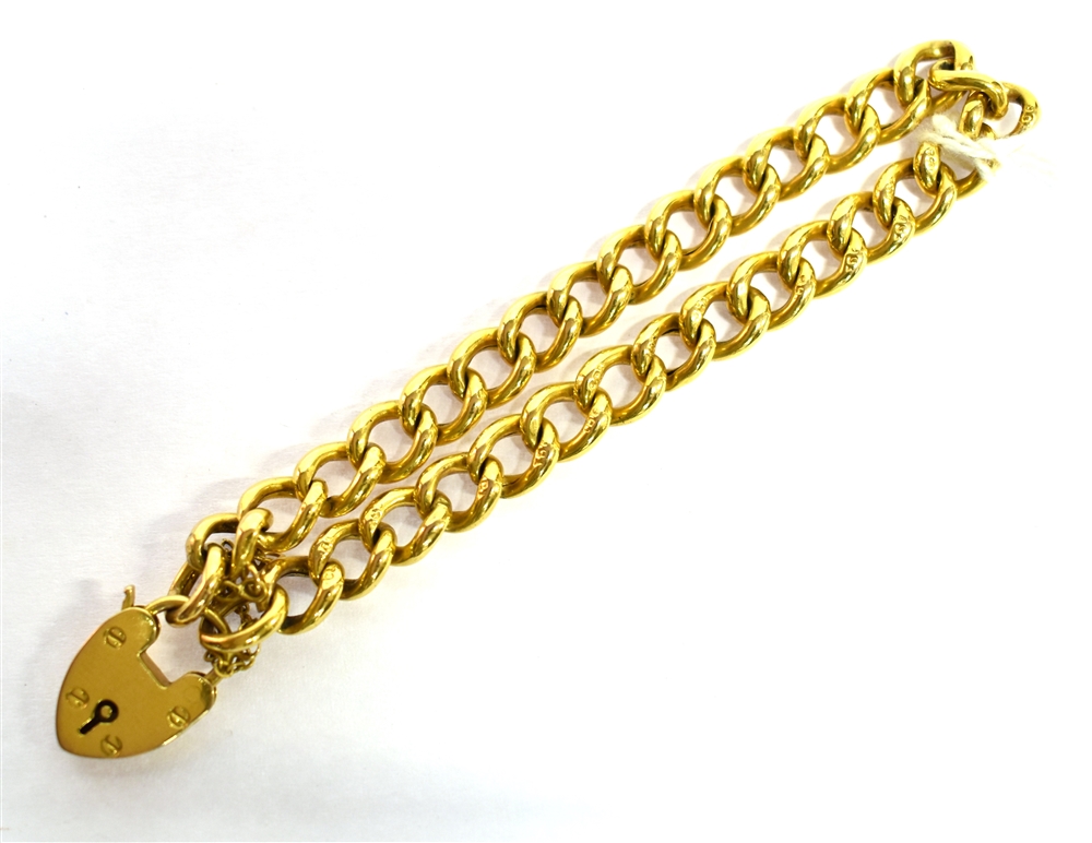 AN EARLY 20TH CENTURY 9CT GOLD CURB LINK BRACELET With padlock fastener, the twisted curb links of - Image 2 of 2