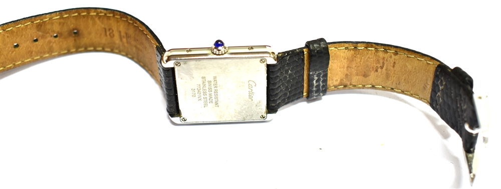 A LADIES CARTIER TANK STAINLESS STEEL WATCH On a leather strap, ivory coloured oblong dial, black - Image 3 of 4