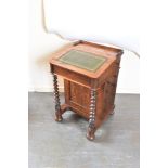 AN EARLY VICTORIAN ROSEWOOD DAVENPORT DESK the slope top with gilt tooled green leather inset